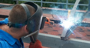 man welding a rack in los angeles
